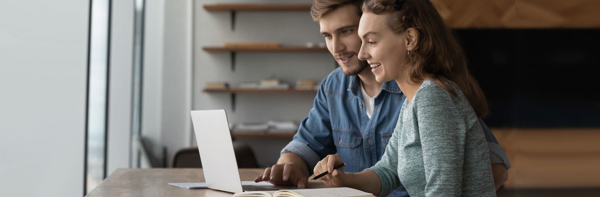 couple in front of laptop